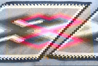 A good Navajo Eye Dazzler scatter rug, early 20th century. Some light staining, loose threads in one