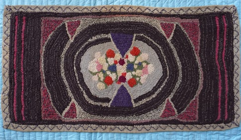 A good early folk art free style hooked rug on burlap, with crocheted homespun border having a