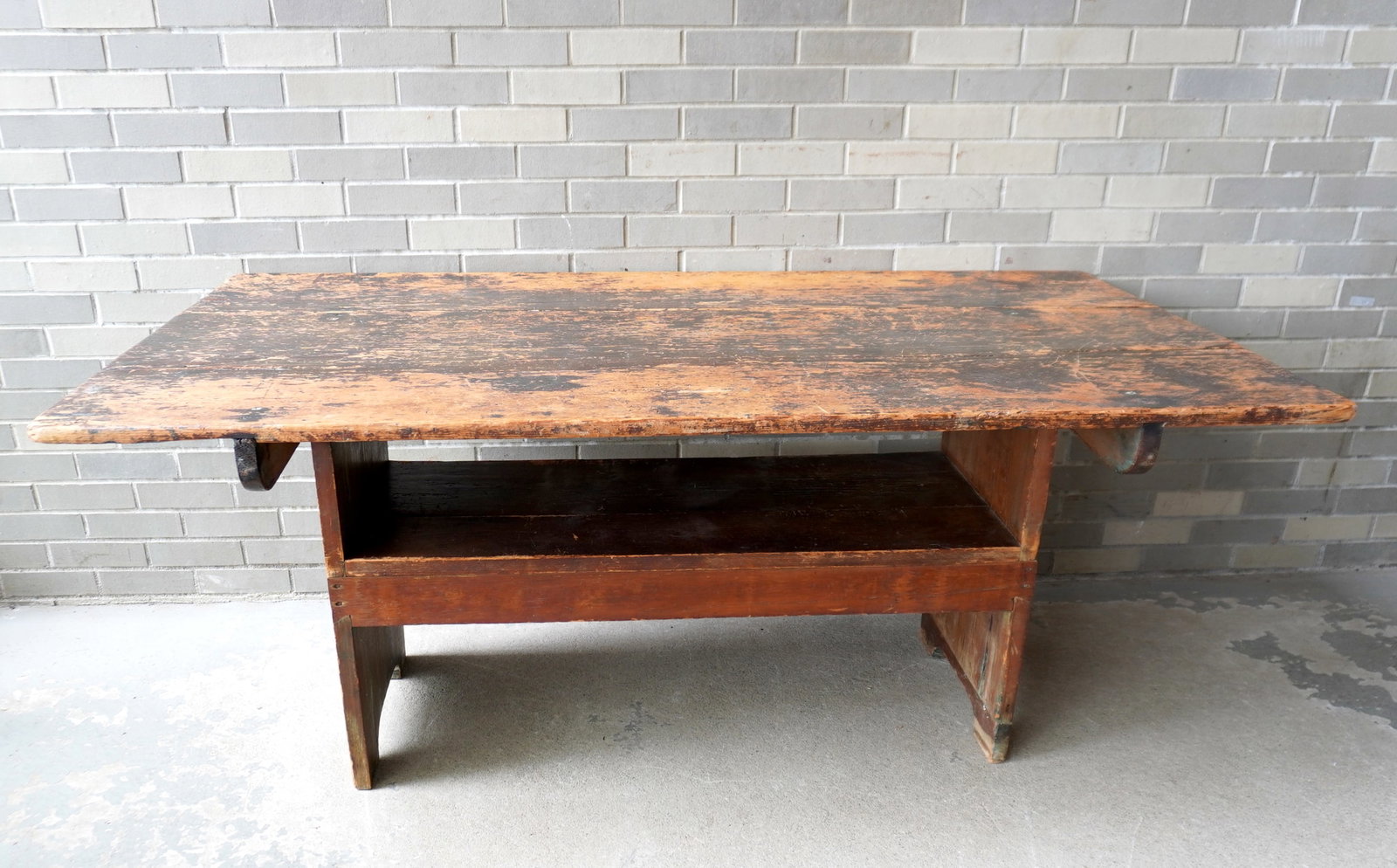 A good American country kitchen hutch table, the top in old worn Spanish brown paint with some: A good American country kitchen hutch table, the top in old worn Spanish brown paint with some surface scratches due to normal usage, circa 1830-50. From the worn marks on the seat, you can see this t