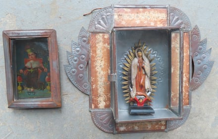 Two folk art Spanish Colonial Nichos in tin currently housing retablos. The first with a punched tin