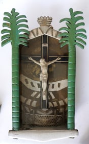 A folk art wooden nicho housing a Crucifix (the crucifix itself in wood, and Jesus in composition),