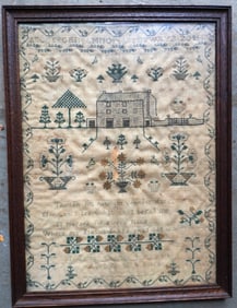 A pictorial alphabet and verse sampler decorated with house with a double wide fence and trees over