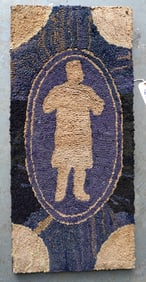 A folk art mounted hooked rug having fan shaped corners, striated background and a central figure of