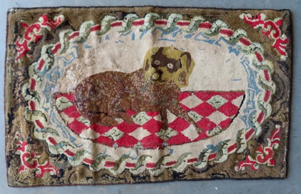 A folk art hooked rug, probably Waldoboro, depicting a Spaniel dog resting on rug, wool on burlap,