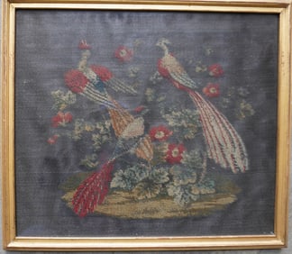An embroidery on horse hair depicting 3 exotic birds within a floral arrangement. Appears to be