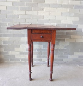 A Sheraton tiger maple 1 drawer drop leaf sewing stand on turned legs, circa 1820. One leaf slightly