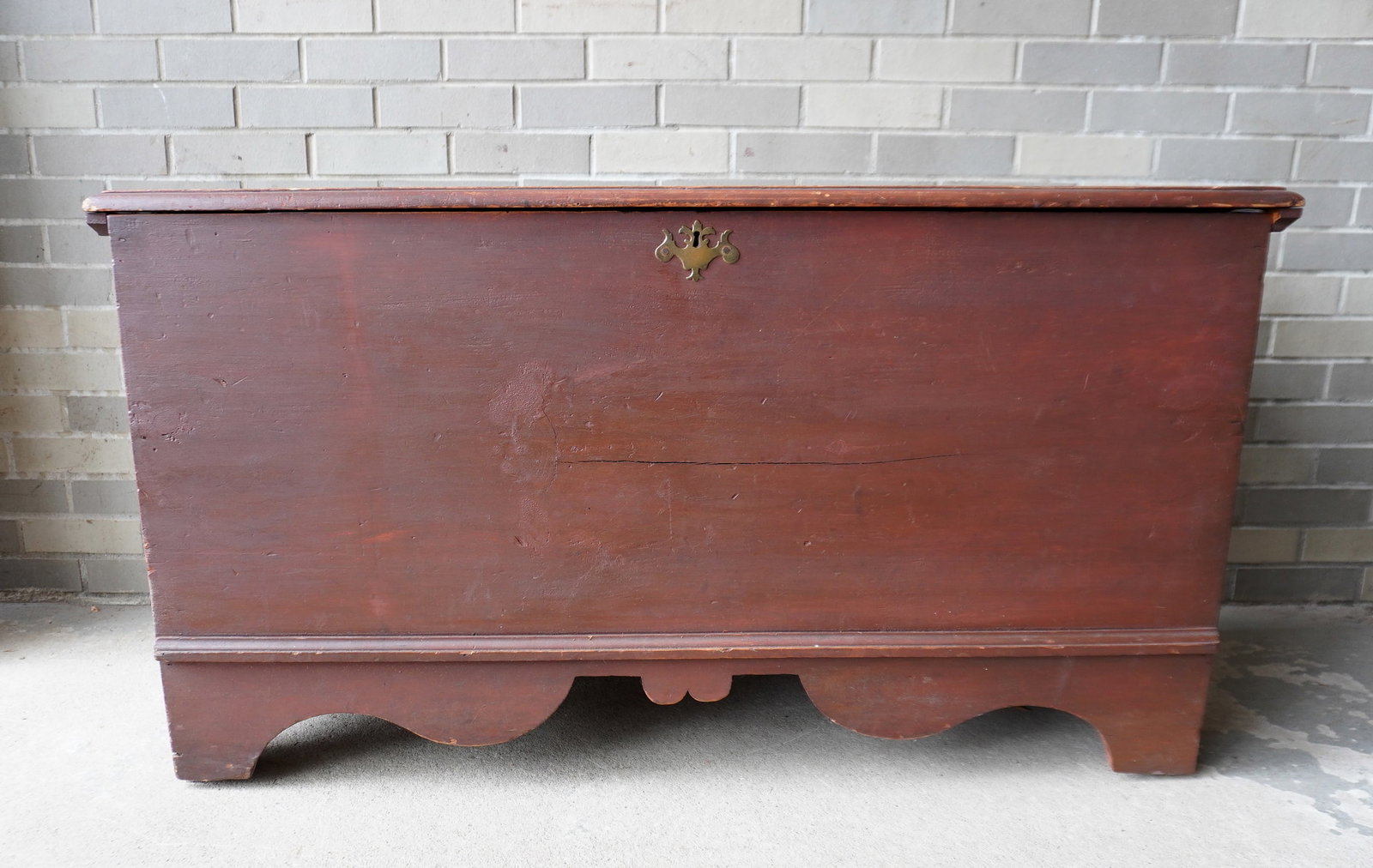 A good New England blanket box, late 18th century. The lid with molded edge, cotterpin hinges,: A good New England blanket box, appears to retain original red paint, late 18th century. The lid with molded edge, cotterpin hinges, original lid cleats applied with hand made nails, and beautiful cut