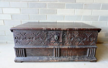 A large size oak Bible box or storage box, with molded edge to lid with repair, carved decorations