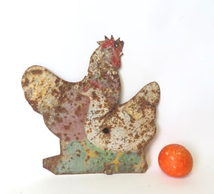 A tin country store silhouette poultry sign in original worn paint depicting a rooster and chicken,