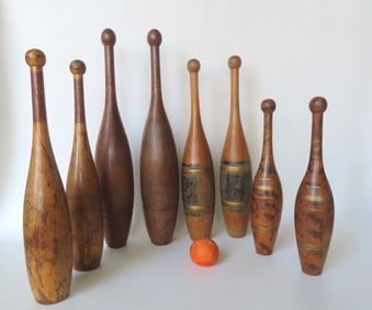 Grouping of 4 pair of exercise dumbbells, most appear to be in maple. One pair with traces of black