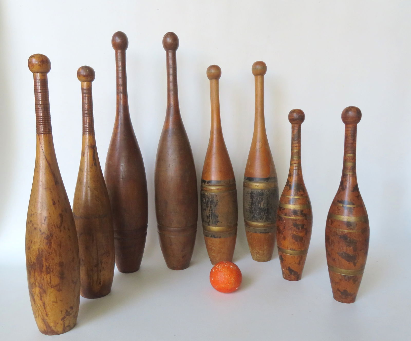 Grouping of 4 pair of exercise dumbbells, most appear to be in maple. One pair with traces of black: Grouping of 4 pair of exercise dumbbells, most appear to be in maple. One pair with traces of black and gold bandings and signed "Wright & Ditson / 4 LB" - 21 3/4"H; the largest pair with traces of bl