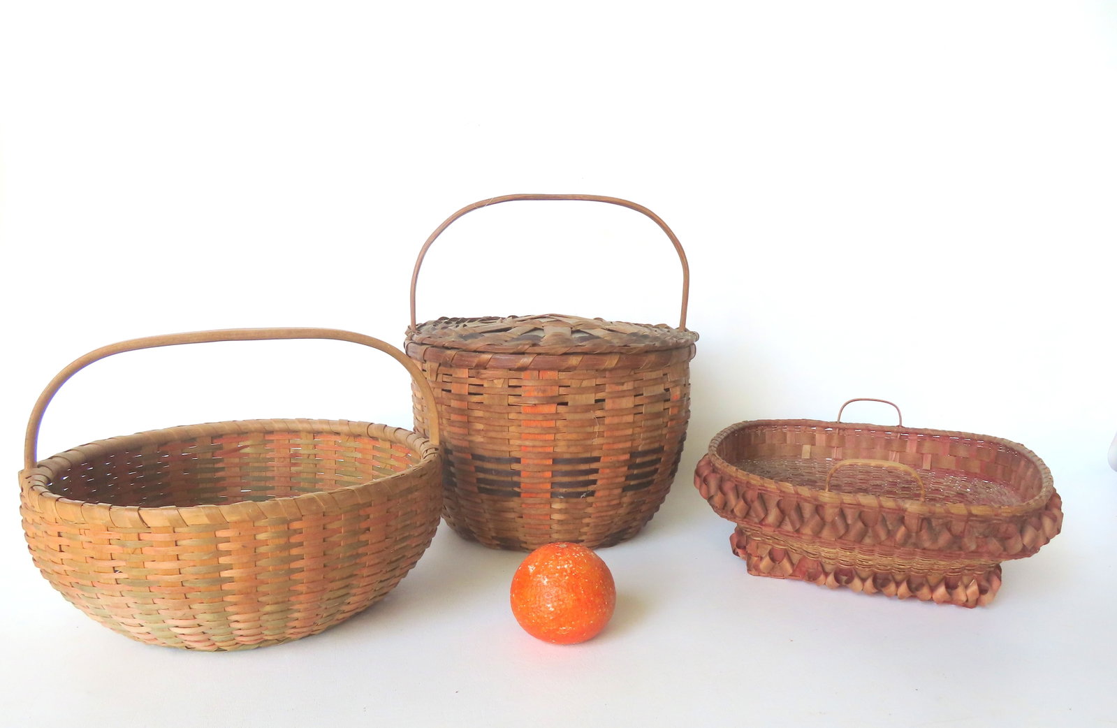 Grouping of 3 early splint baskets including a good lidded pie basket with single loop handle - 13"H: Grouping of 3 early splint baskets including a good lidded pie basket with single loop handle - 13"H x 11 1/4" diameter - very good condition, no noticeable splint breaks - note the painted bands; a v