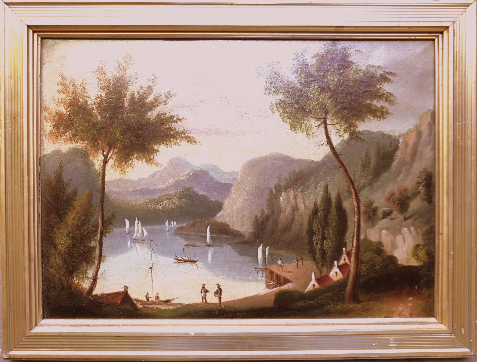 O/B Hudson River school depicting houses and figures along river's edge with sailboats and paddle: O/B Hudson River school depicting houses and figures along river's edge with sailboats and paddle wheeler in river surrounded by mountains, mid to late 19th century. Appears to be housed in original l