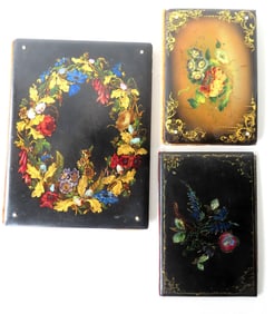 Three Victorian hand painted black lacquered paper mache book covers or photo albums, decorated with