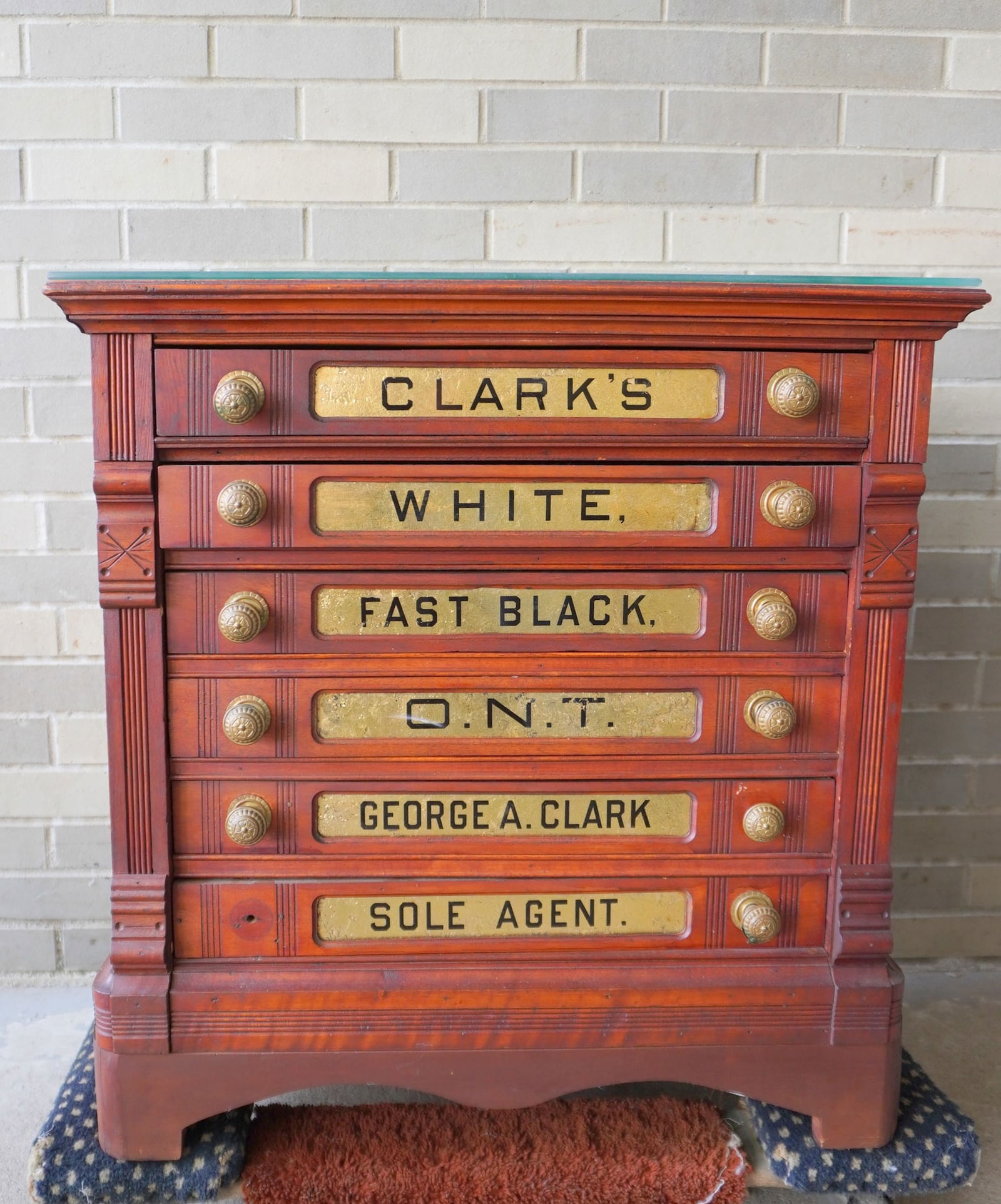 A refinished Clark's stained cherry 6 drawer spool cabinet each with original reverse painted: A refinished Clark's stained cherry 6 drawer spool cabinet each with original reverse painted inserts on drawer fronts marked CLARK'S - WHITE - FAST BLACK - etc. - missing 1 pull, otherwise very good