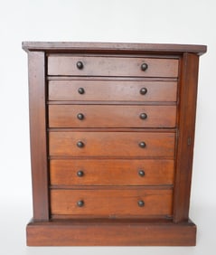 A table top 6 drawer black walnut sidelock specimen cabinet, each drawer hand dovetailed with