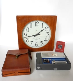 Grouping of IBM Corporation collectibles including: An IBM oak slave clock signed "International