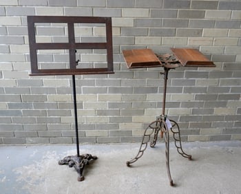 An oak adjustable floor standing book holder & music stand with iron supports. The largest 20"W x
