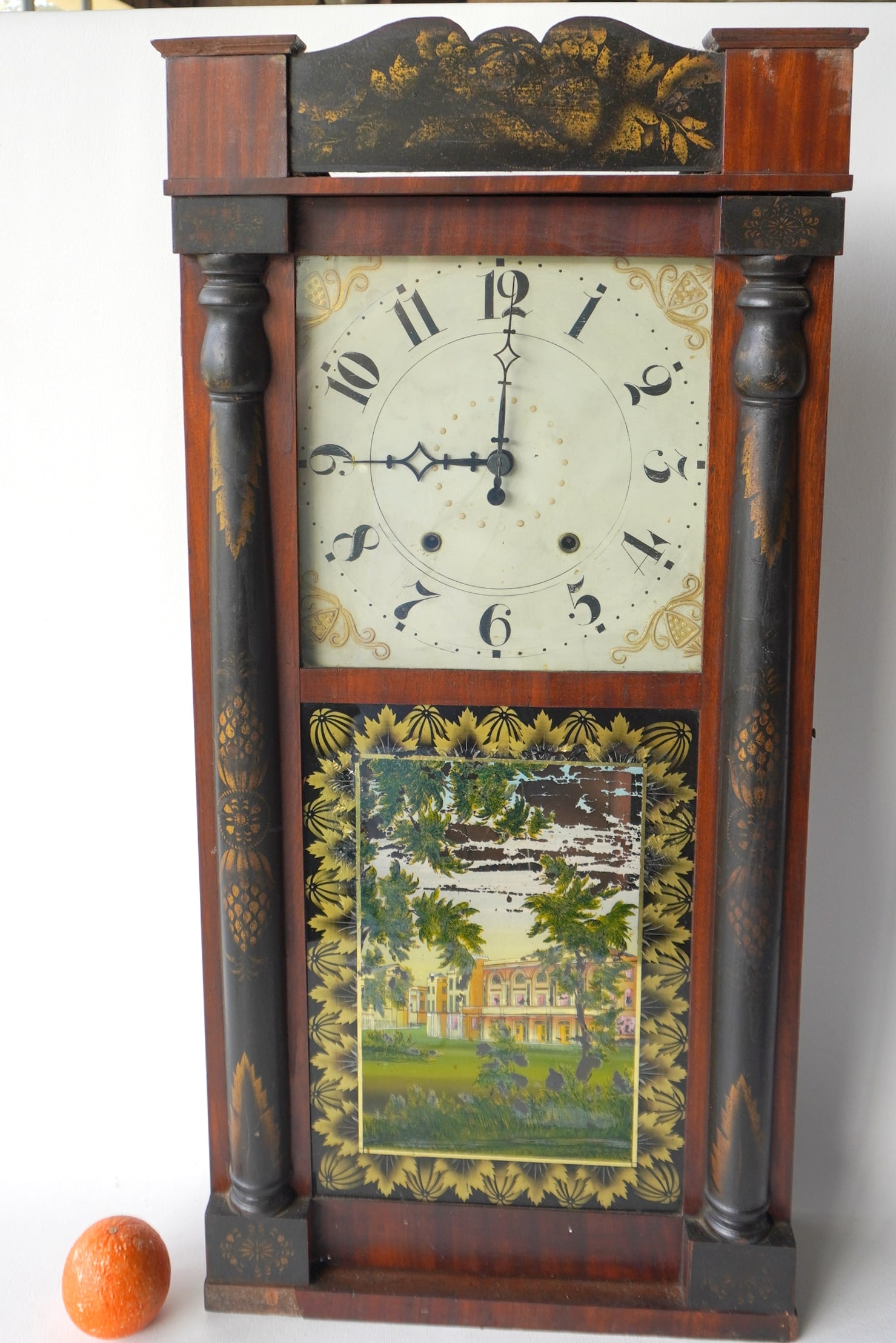 A Jerome & Darrow, Bristol Conn. stenciled shelf clock in the Hitchcock style, circa 1850, having 2: A Jerome & Darrow, Bristol Conn. stenciled shelf clock in the Hitchcock style, circa 1850, having 2 stenciled 1/2 columns flanking the reverse painted glass door depicting an architectural building an