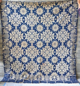 A Jacquard blue and white coverlet signed in corners Elizabeth Perham 1845. The border decorated