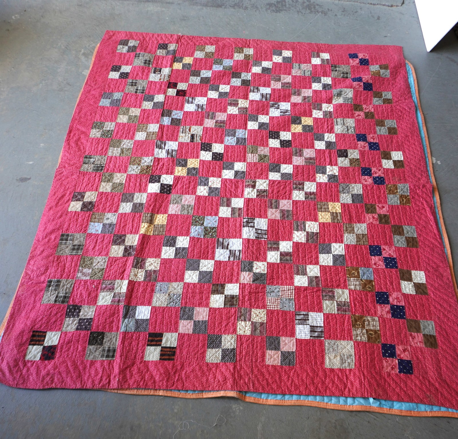 Patchwork quilt in Irish Chain pattern, all hand sewn, circa 1900, 2 small areas of loss along: Patchwork quilt in Irish Chain pattern with 4-patch rows, all hand sewn, circa 1900, a small loss along edge hardly noticeable, small 1" loss on the backing only, else very good condition - 66" x 80".