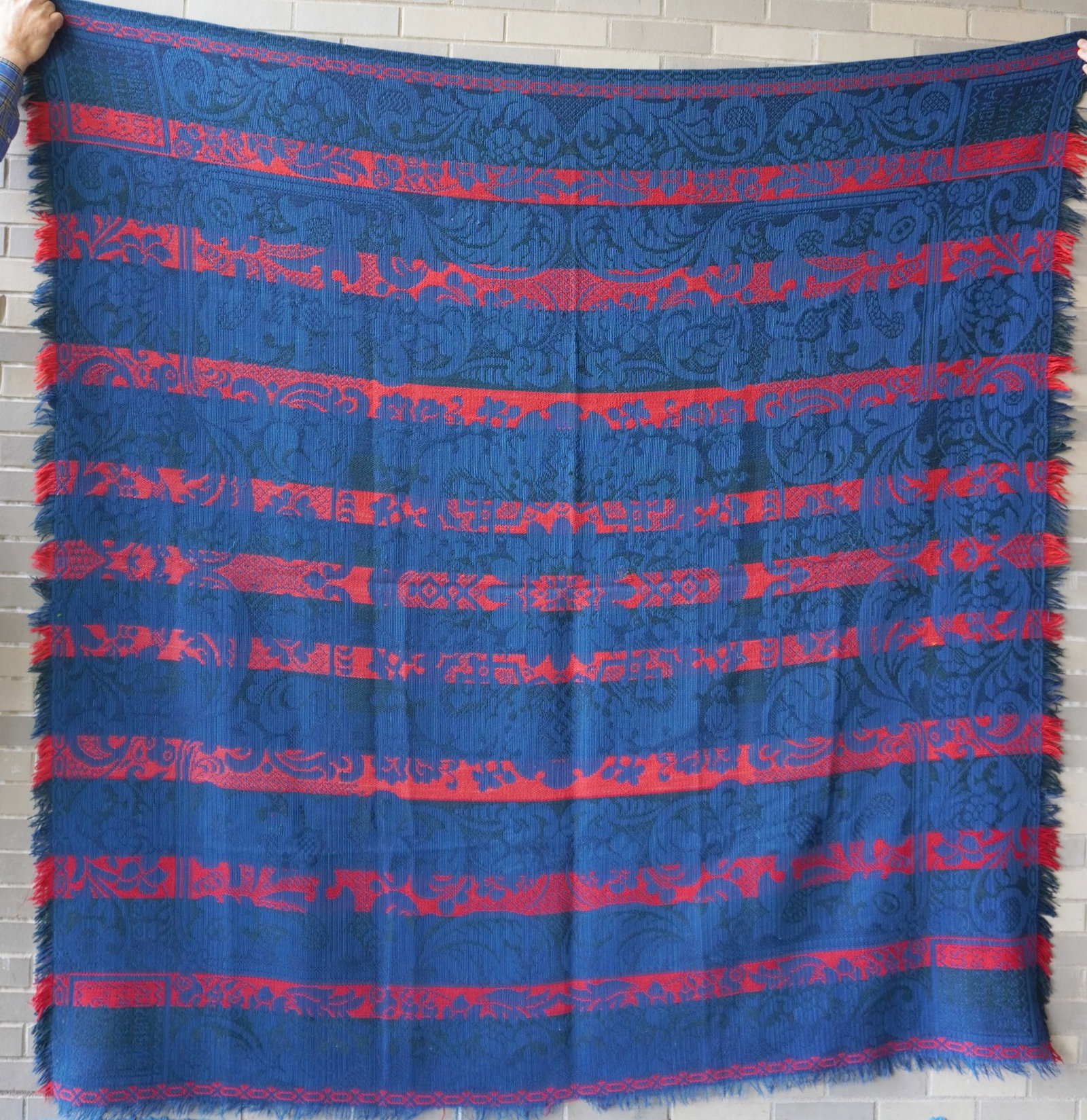 A Pennsylvania 1 piece coverlet, red, blue and dark green, with fringe on 2 sides - design is mostly: A Pennsylvania 1 piece coverlet, red, blue and dark green, with fringe on 2 sides - design is mostly scrolls and flowers. Signed in 4 corners "Ambrosius Muller / Blair Cty / 1868" (Blair Country - Cen