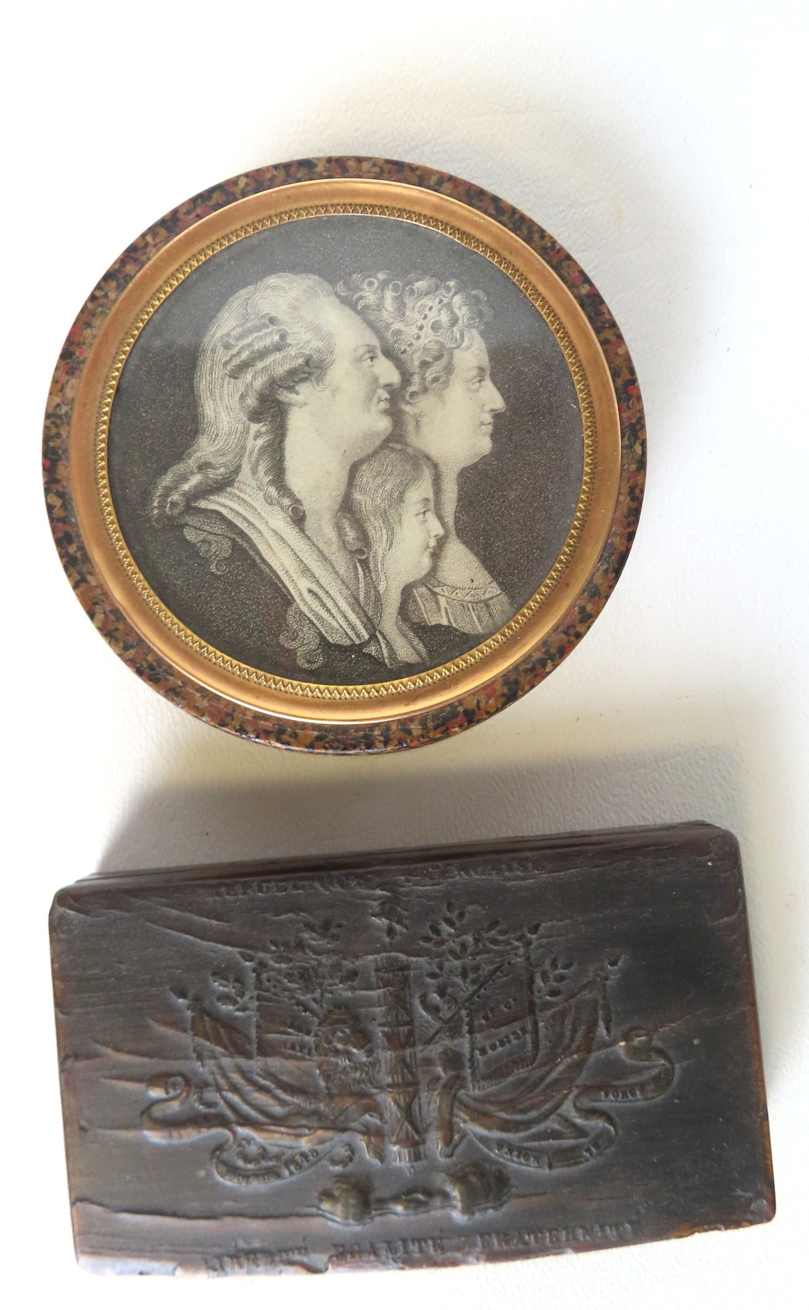 Two French snuff boxes. The first a commemorative snuff box with lithograph on the top of lid: Two French snuff boxes. The first a commemorative snuff box with lithograph on the top of lid depicting the "jugate profiles" of King Louis XVI, Queen Marie-Antoinette, and their son, the Dauphin (lat