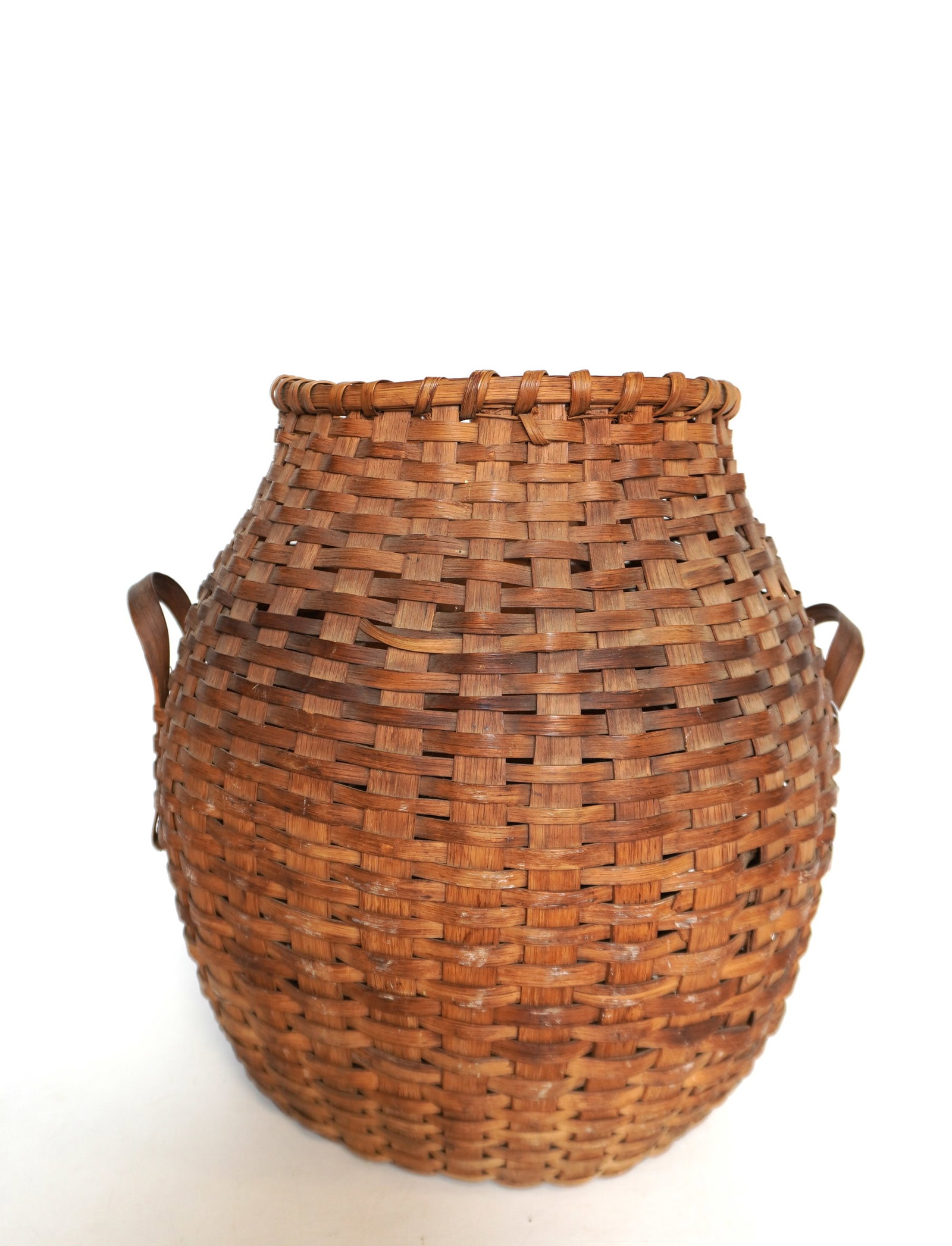 A good primitive American splint woven feather basket with double handles, 19th century, with a very: A good primitive American splint woven feather basket with double handles, 19th century, with a very fine mellow patina. Only 1 splint break on side, otherwise very good condition - measures 17 1/2"H 