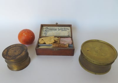 Two boxes of brass jeweler's sieves used for sorting and grading gemstones and pearls - the largest