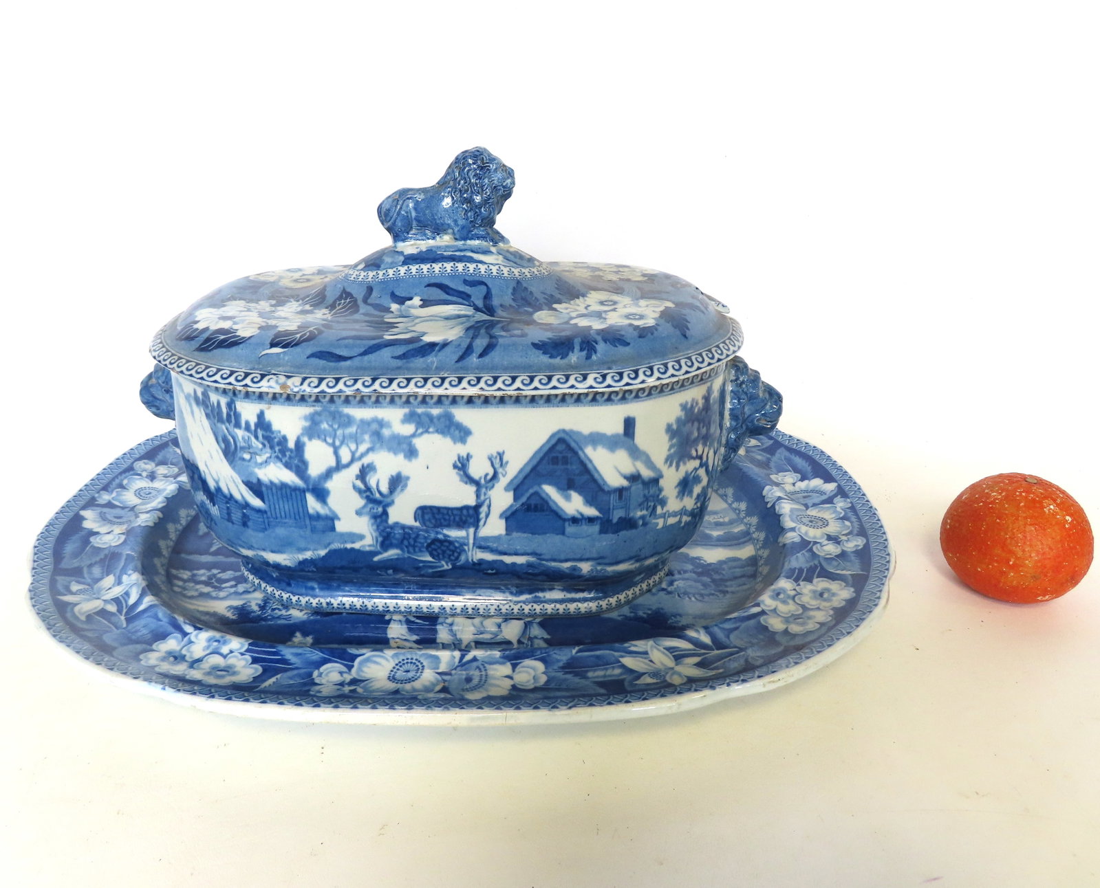 Two pieces of blue & white Staffordshire china, both unmarked, early 19th century, including: The: Two pieces of blue & white Staffordshire china, both unmarked, early 19th century, including: The first, a large platter - the foreground decorated with a genre scene of family with goat near waterfal