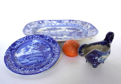 Three pieces of blue and white Staffordshire transferware china including: Platter in the "Wild