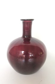 A dark olive green onion bottle of with flared rim, pushed up bottom with open pontil, and of