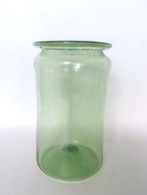 An aqua green apothecary jar with flared rim and pushed up bottom with open pontil, cranberry color,