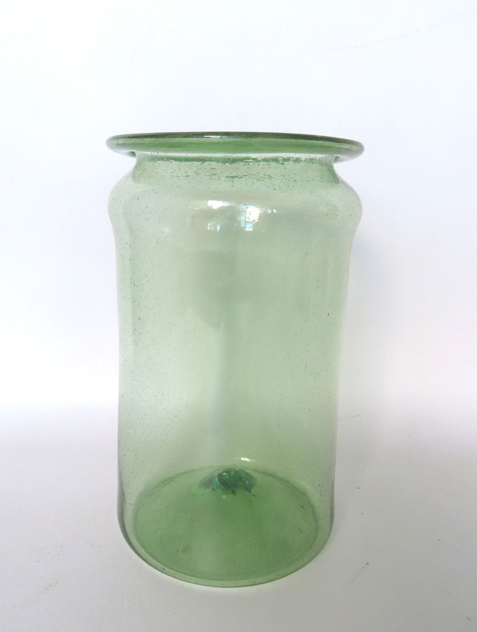An aqua green apothecary jar with flared rim and pushed up bottom with open pontil: An aqua green apothecary jar with flared rim and pushed up bottom with open pontil,very good condition. Probably late 18th century. Measures 9 3/4"H x 6"W. Provenance: From a private collection, Kent