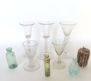 A grouping of 9 early glassware collectibles including: 5 hand-blown wines, 2 with twisted stems,