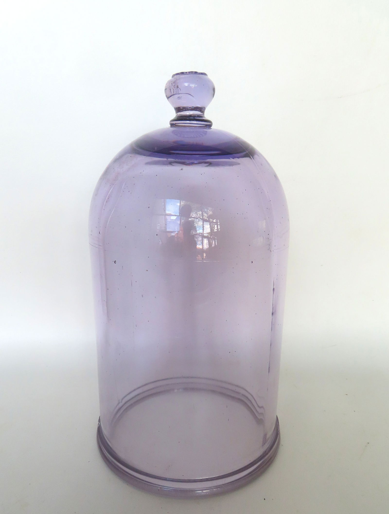 A scientific laboratory heavy glass bell jar in light purple color with flower shaped finial, 19th: A scientific laboratory heavy glass bell jar in light purple color with flower shaped finial, 19th century. Very good condition with no damage - measures 13"H x 7" diameter at base.