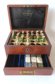 A signed "Leath & Ross" English mahogany homeopathic medicine chest containing 21 small bottles of