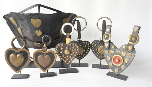 Grouping of 6 leather heart shaped horse harness decorations, all with applied brass ornaments