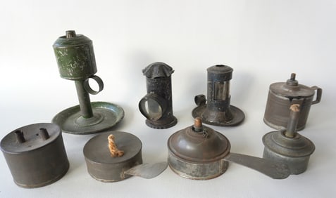 Grouping of 8 early tin lighting devices including: Small candle lantern with finger holder and