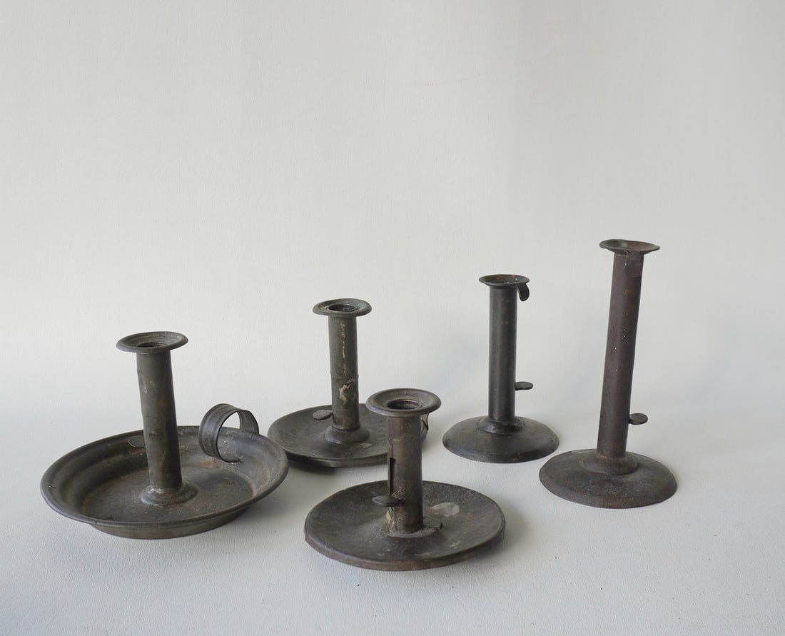 Grouping of 5 hog scraper candlestick, all early to mid 19th century - the tallest signed illegibly: Grouping of 5 hog scraper candlestick, all early to mid 19th century - the tallest signed illegibly on the thumb ejector and measures 7 1/4"H. A smaller one with drip pan is dated 1852 on ejector. Som