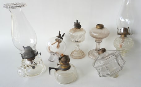 Seven various 19th century oil lamps including 3 peg lamps, one with 3 burners likely Sandwich and