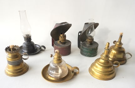 Seven various miniature brass and tin lamps, all 19th century, including: Brass and glass finger