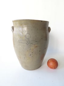 Stoneware slightly ovoid jar with incised flower below 3 concentric incised lines - the flower