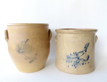 Two stoneware crocks, 2 gallon. The first decorated with a light cobalt blue flower - 10 3/4"H x 9