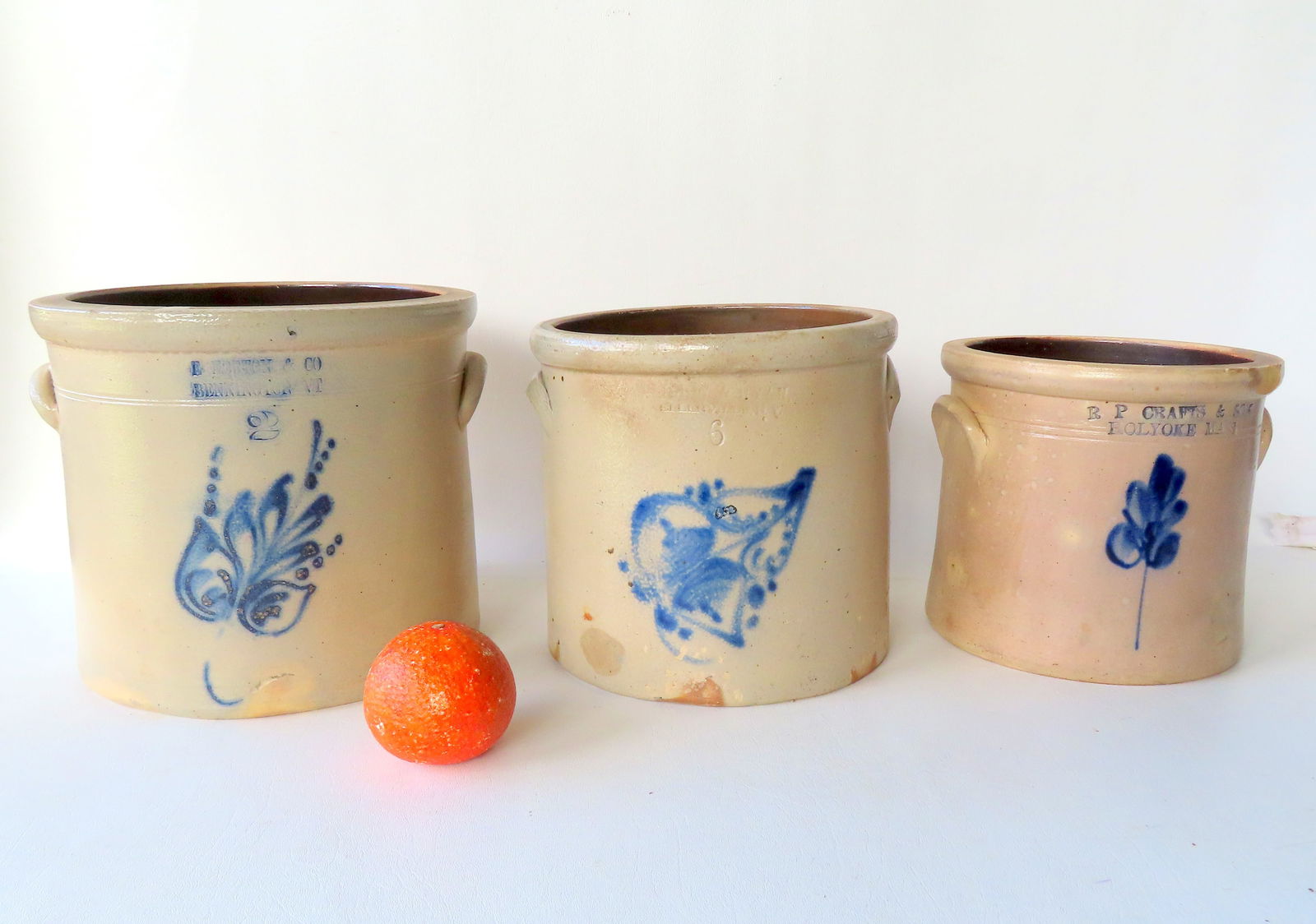 Three stoneware crocks including: 2 gallon "E. NORTON & CO. / BENNINGTON VT" - 8 3/4"H x 10": Three stoneware crocks including: 2 gallon "E. NORTON & CO. / BENNINGTON VT" - 8 3/4"H x 10" diameter - some stains and minor rim chips; 6 quart with the impressed mark of "….ELLENVILLE NY" - decora