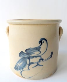 A stoneware crock decorated with a cobalt blue bird on branch, probably 2 gallon - measures 9 1/4"H