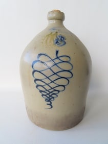 A stoneware jug, 3 gallon, with the impressed mark of "BURGER & LANG / ROCHESTER N.Y." and decorated