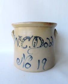 A stoneware script crock advertising for "W.C. Dobbs / No. 19" - some glazing stains and the stain