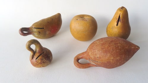 Grouping of 5 redware fruit and vegetable banks in original paint, mid 19th century. All with some