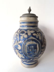 A Westerwald stoneware tankard brushed in cobalt blue, and decorated with incised leaves an a vine